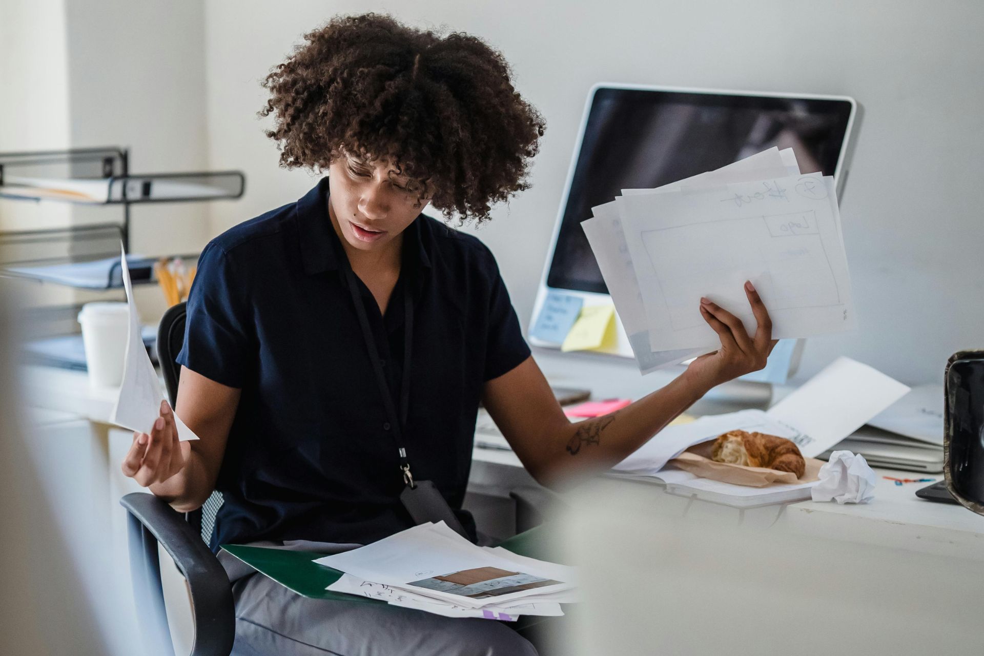 Woman confused and frustrated by insurance paperwork