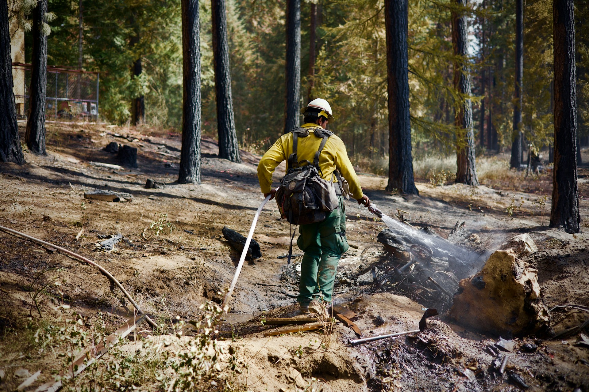 firefighter mopping up a wildfire