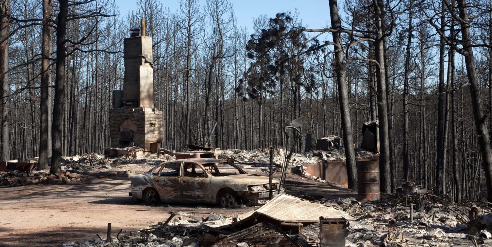 aftermath of wildfire damage to a house