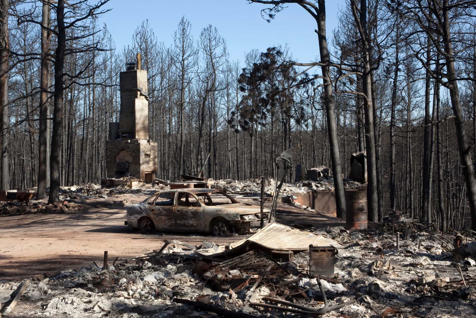 aftermath of wildfire damage to a house