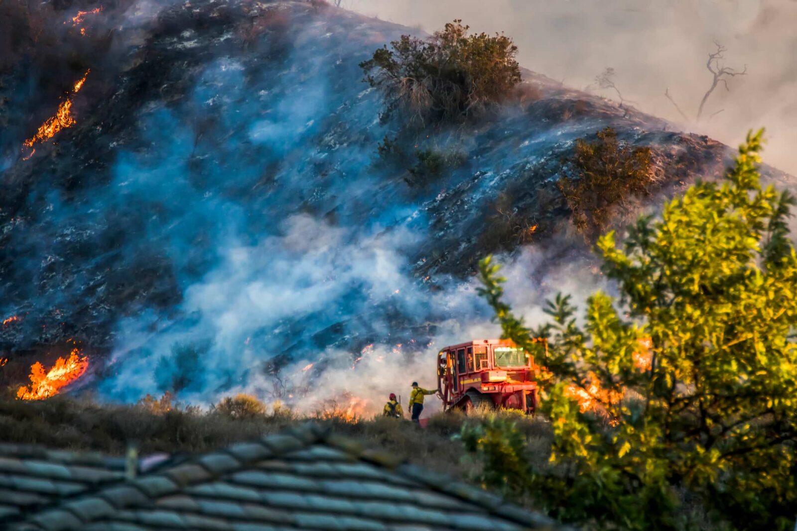 fire on a hill seen from point of view of home