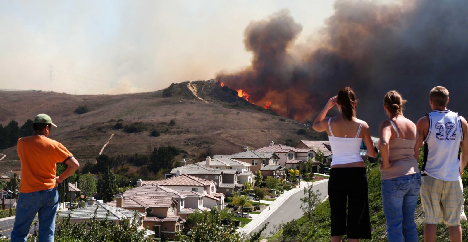 people watching brush fire near their homes