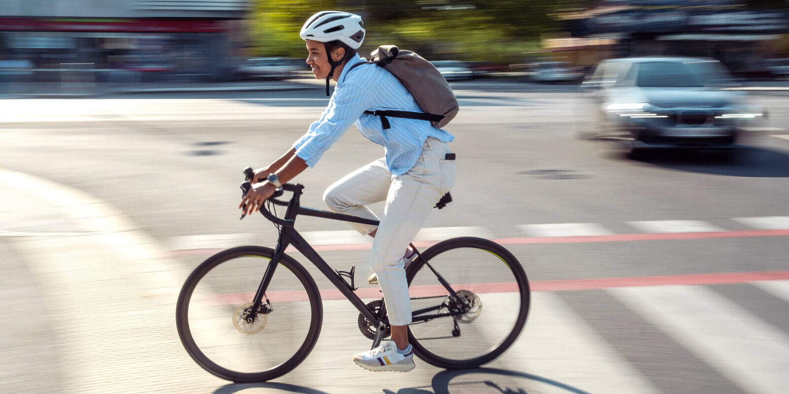 cyclist riding in crosswalk in city